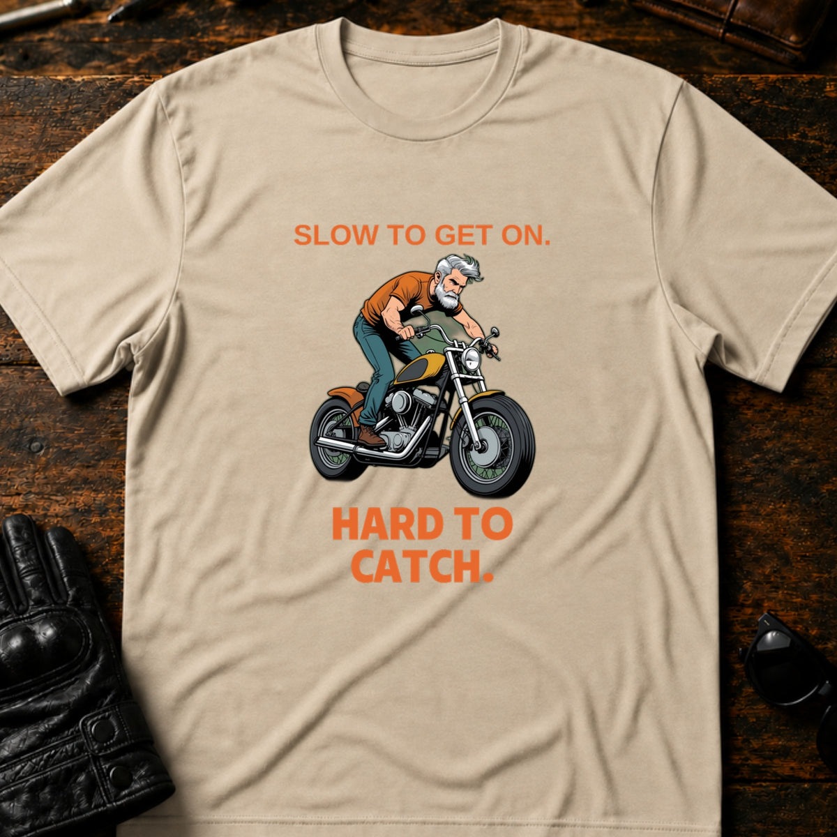 Slow To Get On Hard To Catch Older Biker T-Shirt, sand
